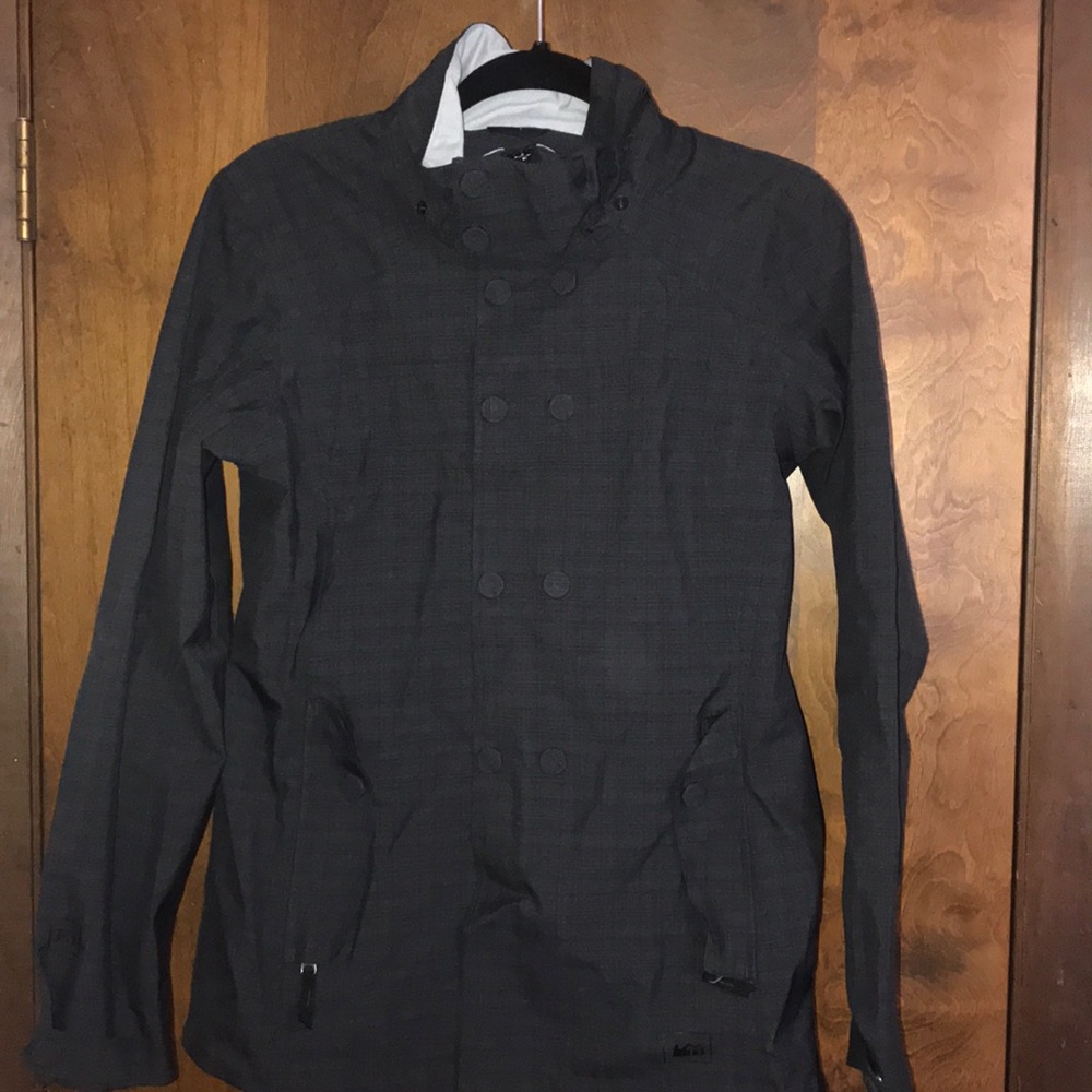 Medium gray REI zip up rain coat with pockets